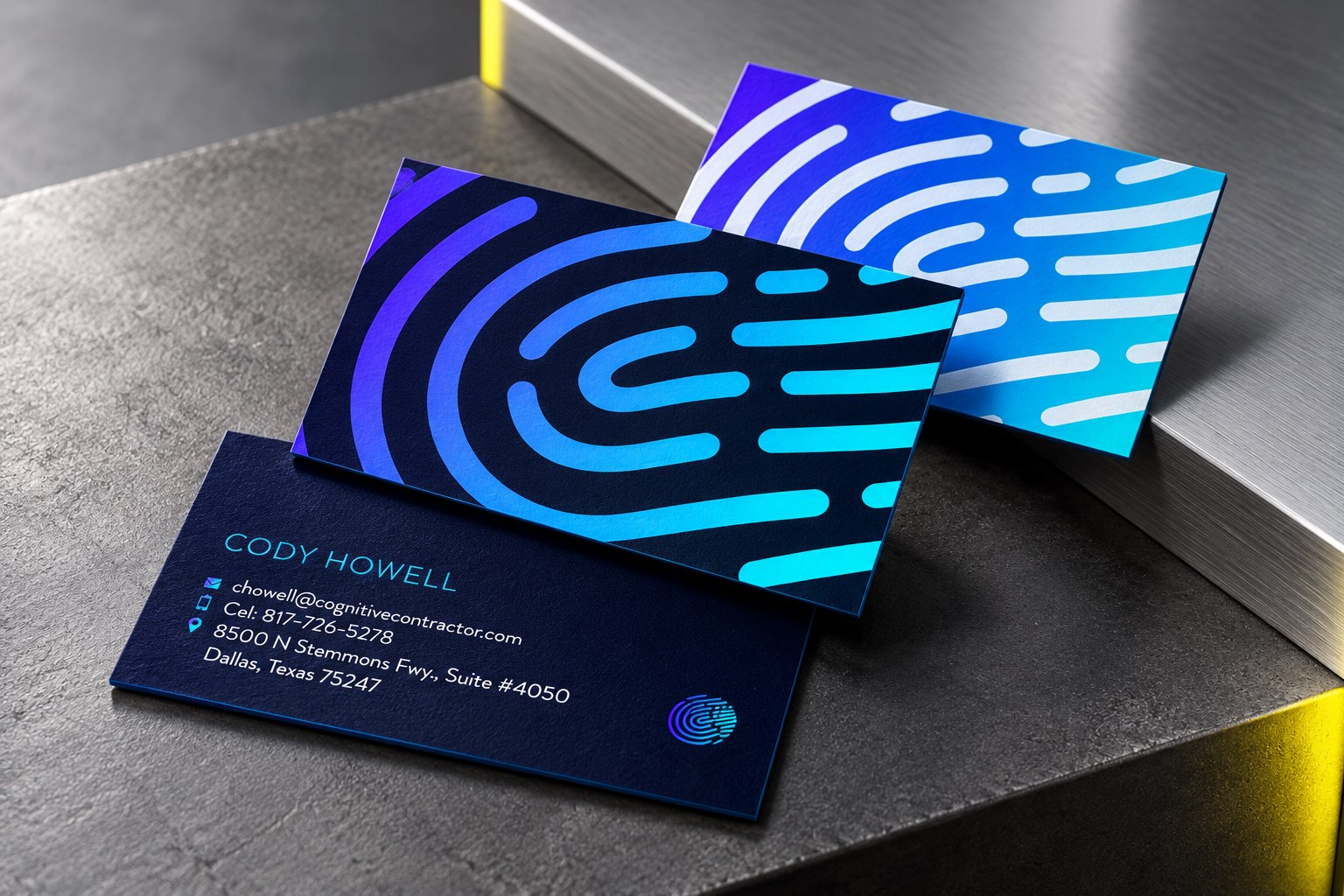 Cognitive identity business cards on a graphite studio surface